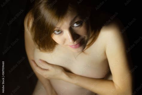 Sexy Pregnant Woman Nude Stands On A Black Background Stock Photo Adobe Stock