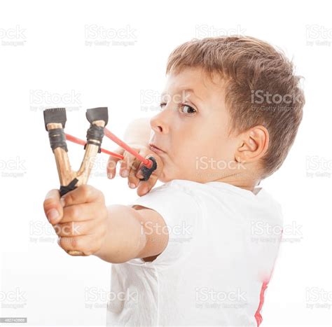 Little Cute Angry Boy With Slingshot Isolated Stock Photo Download