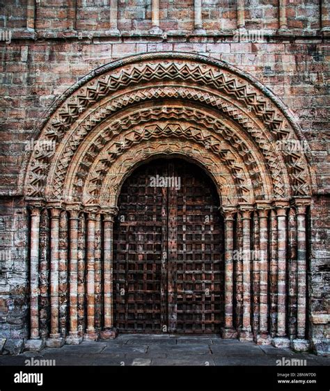 A Gothic Entrance To A Church Or Cathedral With Heavy Wooden Door And