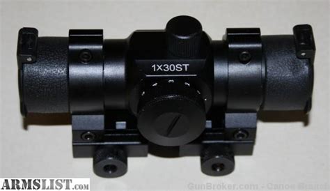 ARMSLIST - Bushmaster AR15 Red Dot scope included item #90689