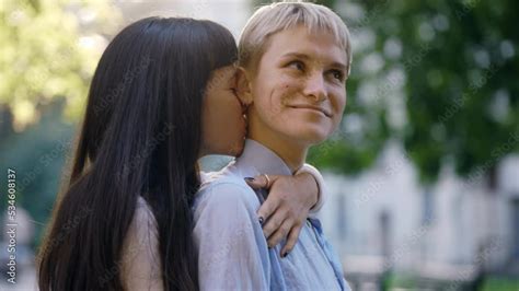 Woman Kissing Her Fiance Neck In Public Place Lesbian Girlfriend Showing Love To Her Partner
