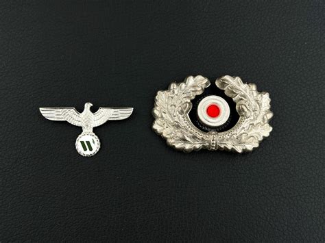 WARSTORY AUCTION - Кокарды Вермахт