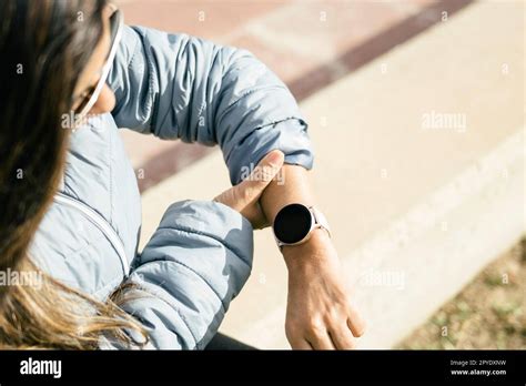 Latina Woman Checking Heart Rate On Smart Watch Stock Photo Alamy