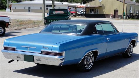 classic blue buick parked   street