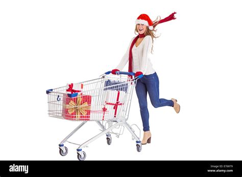 Festive Blonde Pushing Trolley Full Of Gifts Stock Photo Alamy
