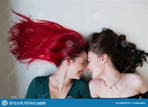 Top View Of Two Women Lying Side By Side Lesbian Intimacy Stock Photo