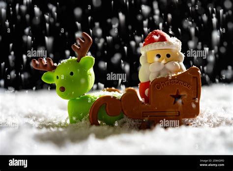 santa claus and reindeer at a snowing night Stock Photo - Alamy