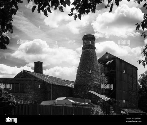 An Old Pottery Silhouetted Against Bright Clouds Featuring The History