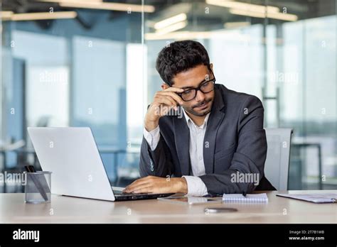 tired male office worker sitting  desk  front  laptop  desk
