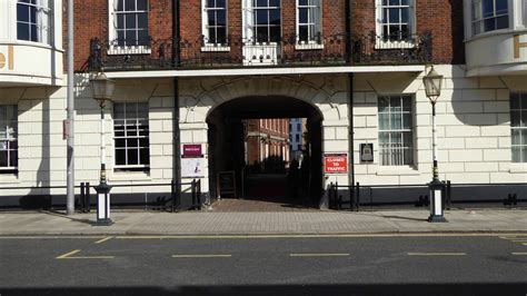Two Lampstandards Opposite Central Former Carriage Entrance to the