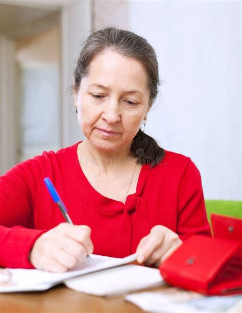 Mature Woman Fills Utility Bills Stock Photo Image Of Indoors Cash