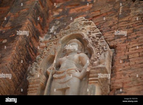 cement figure on brick wall Stock Photo - Alamy