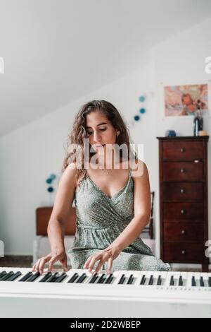 Naked Woman In Apartment Playing Piano Stock Photo Alamy