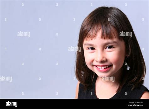 Pretty Brunette Girl Smiling On Blue Background Stock Photo Alamy
