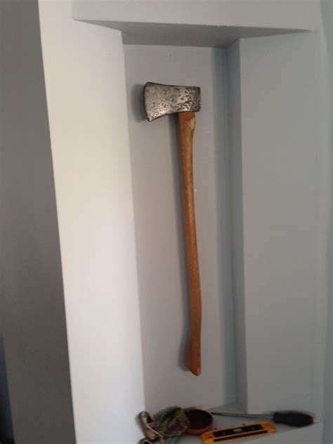 Best way to mount a antique axe to a wall? I recently restored this pawn shop head. No plans to ...