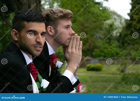 Gay Weddings Grooms Couples Pose For Pictures After Their Wedding Ceremony In Churchyard Stock