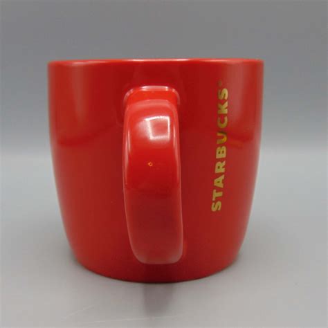 starbucks  oz ceramic coffee mug red wgolden logo holiday