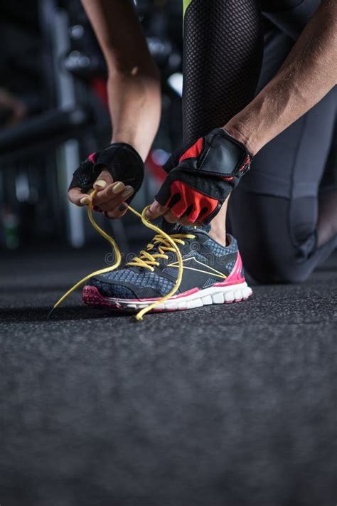 Beautiful Woman Tying Shoelaces At Gym Stock Image Image Of Concept