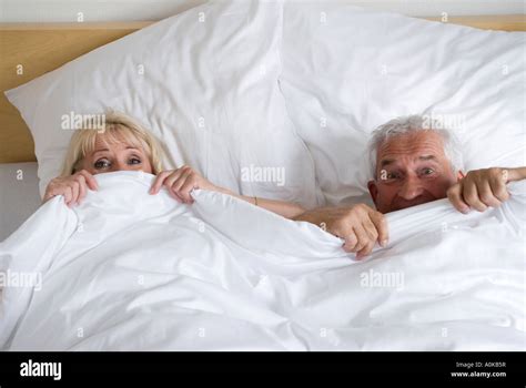 Mature Couple Having Fun In Bed Stock Photo Alamy