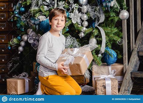 Child Holding Christmas T In Hand Stock Photo Image Of Childhood