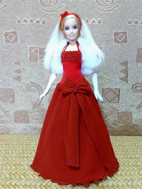 A Barbie Doll Wearing A Red Dress And White Hair