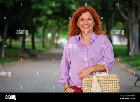 Outdoor Portrait Of Smiling Mature Redhead Woman Stock Photo Alamy