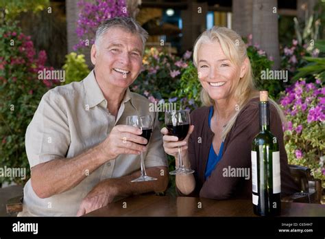 Mature Couple Having Red Wine Stock Photo Alamy