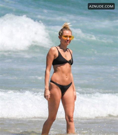 Miley Cyrus Wears A Black Bikini At The Beach In Byron Bay Australia AZNude