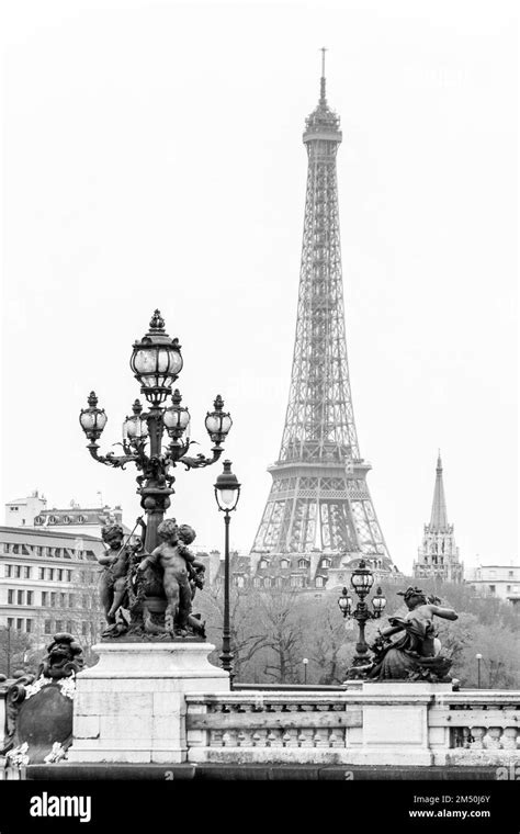 A Grayscale Vertical View Of The Eiffel Tower From Pont Alexandre Iii