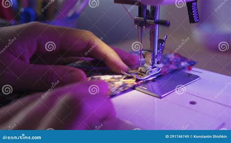 A Woman Stitches A Piece Of Fabric Using A Sewing Machine Stock Video