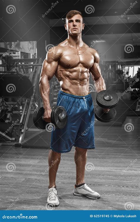 Muscular Man Working Out In Gym Doing Exercises With Barbell Strong Male Naked Torso Abs Stock