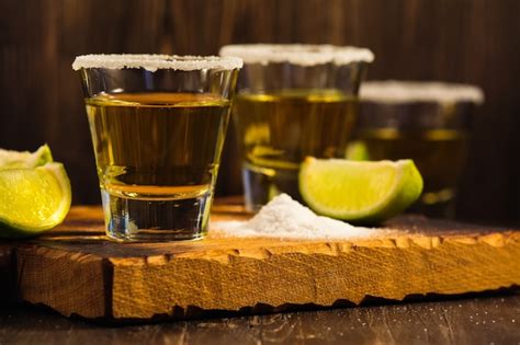 Premium Photo | Tequila shots, salt and lime slices