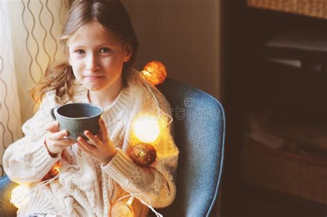 Kid Girl Drinking Hot Cocoa At Home In Winter Weekend Sitting On Cozy Chair Stock Image Image