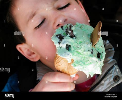 Boy eating ice cream Stock Photo - Alamy