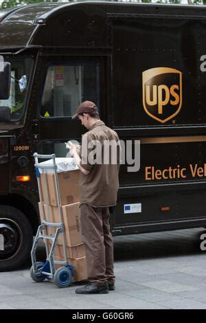 Electric Vehicle UPS United Parcel Services postal delivery van driving ...