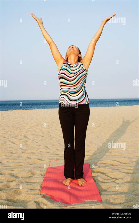 Mature Woman Exercising On The Beach Stock Photo Alamy