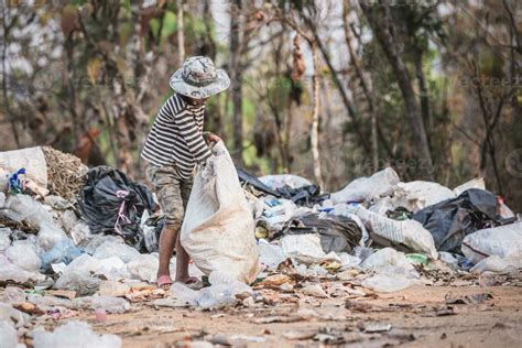 environment Earth Day, Child sitting to separate garbage to be recycled