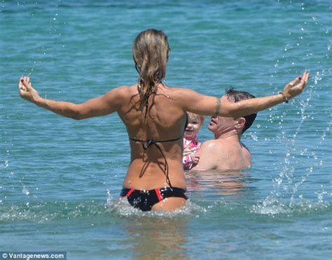 Elisabetta Canalis Shows Off Her Figure In Bikini On Beach