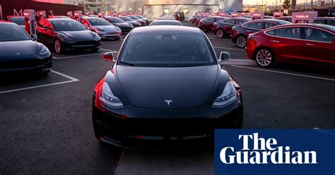 Tesla shares fall more than 7% after company reports record loss