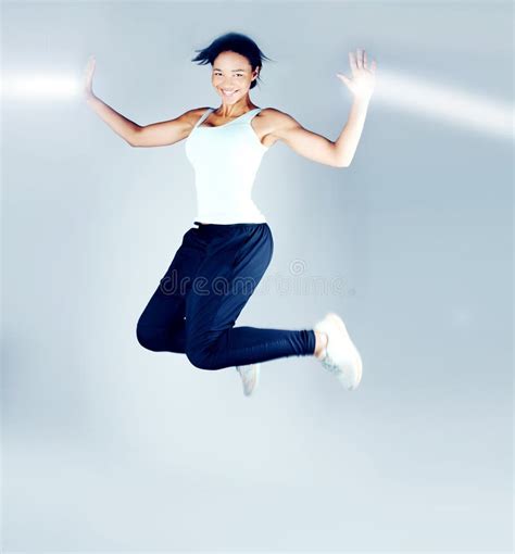 Smiling Brunette Woman Jumping Stock Photo Image Of Modern Fitness