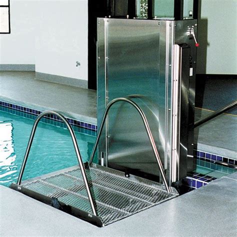 Vertical travel platform built into the pool area to accommodate mobility devices and the need ...