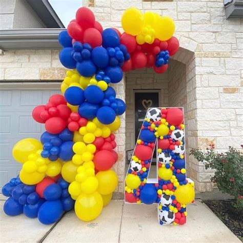 Balloons Are Arranged In The Shape Of Letters And Numbers On A House S