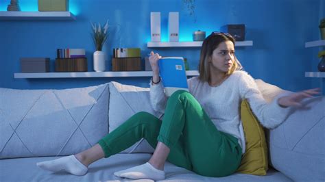 Young woman is afraid at home, she is panicking. 32187740 Stock Video