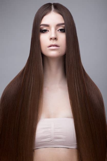 Premium Photo Beautiful Brunette Woman With A Perfectly Smooth Hair And Classic Make Up