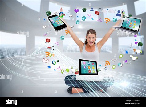 Cheering Blonde Using Laptop With App Icons Stock Photo Alamy