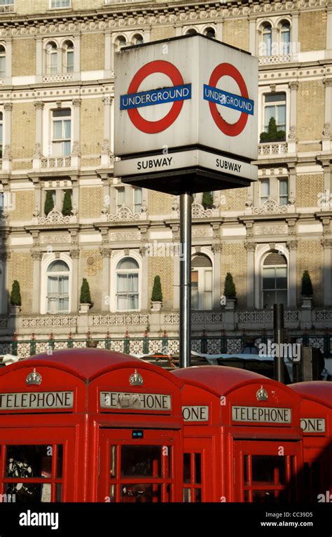 Red Telephone Boxes By A London Underground Tube Station Outside