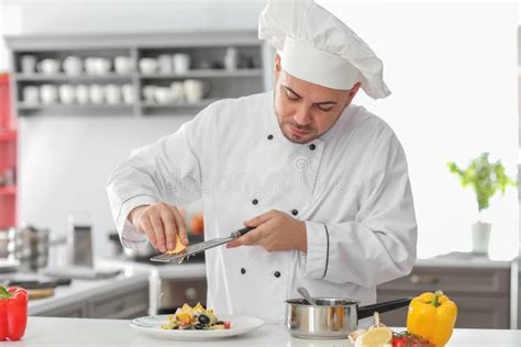 Male Chef Making Tasty Salad In Kitchen Stock Photo Image Of