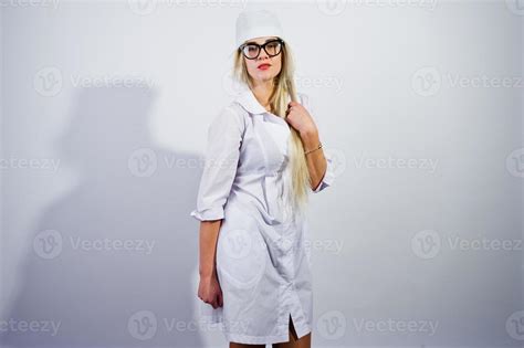 Attractive Blonde Female Doctor Or Nurse In Lab Coat And Glasses Isolated On White Background