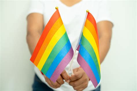 Woman Holding LGBT Rainbow Colorful Flag Symbol Of Lesbian Gay Bisexual Transgender Human