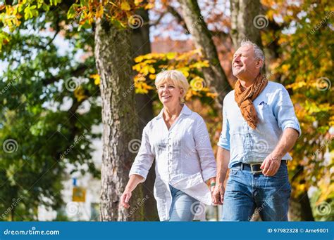 Senior Man And Woman Embracing Each Other In Love Stock Photo Image